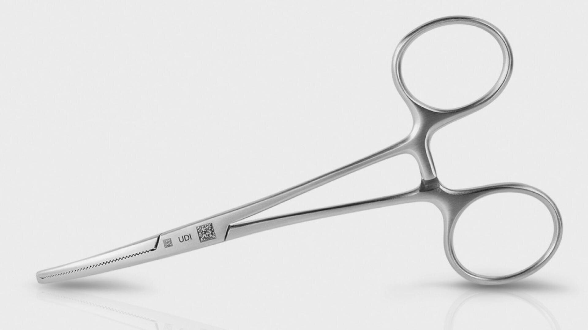 Surgical tweezers made of stainless steel with a curved, serrated tip and two finger rings on a light background.